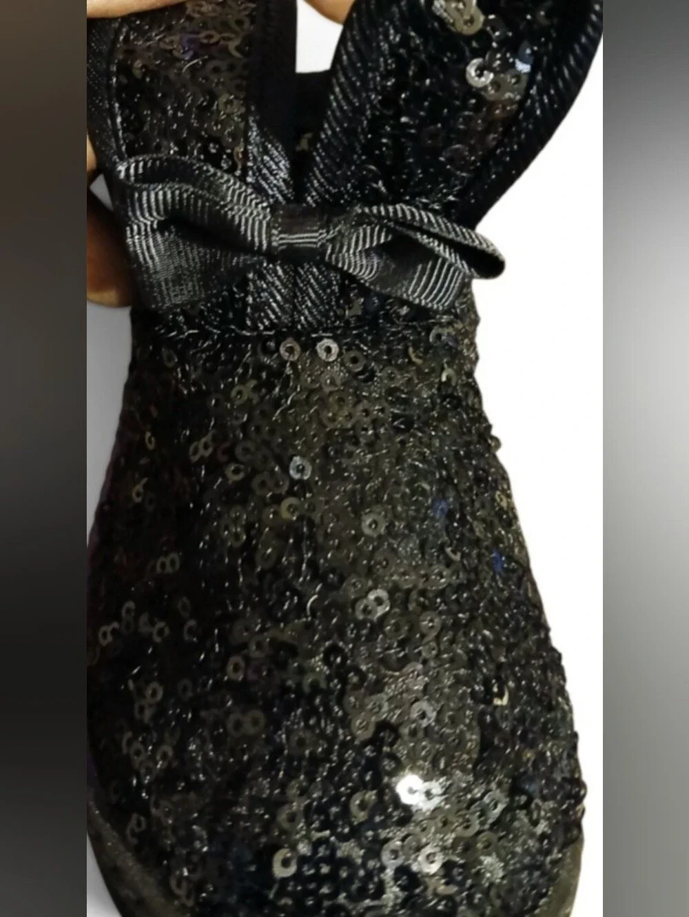 black sequin children's ankle boots with decorative bows and flat fur sole